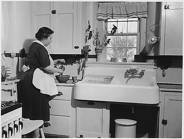 Woman cooking in a kitchen.gif