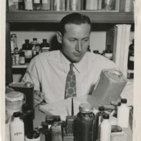 Edward F. Knipling, U.S. Department of Agriculture entomologist, enters, under a code number, one of the preparations to be tested in the search for an effective louse killer for the use of our fighting forces