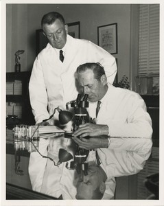 Thumbnail for the first (or only) page of Dr. Edward F. Knipling (seated) and Dr. Raymond C. Bushland in laboratory.