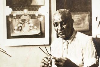 George Washington Carver working with plants