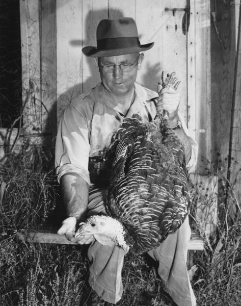 Stanley J. Marsden holding a turkey