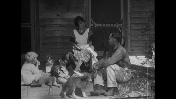 image of a family talking on a farm porch